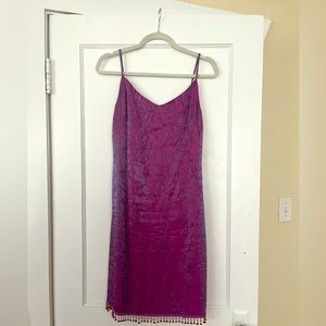 Vintage straight silhouette dress with beaded fringe at the hem. Light purple.